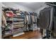 Walk-in closet with shelving, hanging storage, and hardwood floors at 7630 Glisten Ave # 304, Atlanta, GA 30328