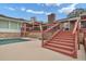 Backyard featuring a pool, deck, and stairs at 2716 Georgia 16, Carrollton, GA 30116