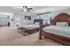 Spacious bedroom featuring two queen beds, bench, neutral carpet, and light grey walls at 2716 Georgia 16, Carrollton, GA 30116