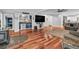 Open-concept living room featuring a bar, wood floors, and lots of entertaining space at 2716 Georgia 16, Carrollton, GA 30116