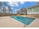 Large pool with a deck, surrounded by lush greenery, offering a tranquil retreat at 2716 Georgia 16, Carrollton, GA 30116