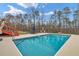 A sparkling in-ground pool with a sun deck, providing a perfect oasis for relaxation at 2716 Georgia 16, Carrollton, GA 30116