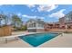 Refreshing outdoor pool with a diving board, adjacent to a spacious patio and the home at 2716 Georgia 16, Carrollton, GA 30116