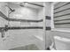 Bathroom featuring a standing shower with glass door and gray and white tile at 2716 Georgia 16, Carrollton, GA 30116