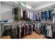 Walk-in closet featuring ample storage shelves, laminate floors, and neutral-colored walls at 2716 Georgia 16, Carrollton, GA 30116