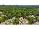 Lush neighborhood aerial view with tree coverage and glimpses of the city skyline at 2750 Vinings Orchard Se Cir, Atlanta, GA 30339