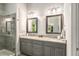 Bathroom with a double vanity, granite countertops and large mirrors at 2750 Vinings Orchard Se Cir, Atlanta, GA 30339