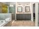 Modern bathroom with a glass shower, soaking tub, and double vanities at 2750 Vinings Orchard Se Cir, Atlanta, GA 30339