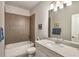 Stylish bathroom featuring tub-shower, neutral tiling, and modern vanity with sleek fixtures at 2750 Vinings Orchard Se Cir, Atlanta, GA 30339