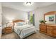 Bright bedroom with carpet floor, wooden furniture, and natural light at 2750 Vinings Orchard Se Cir, Atlanta, GA 30339