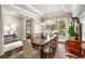 Formal dining room with a large table, elegant chandelier, and large window providing natural light at 2750 Vinings Orchard Se Cir, Atlanta, GA 30339