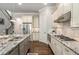 Well-equipped kitchen featuring stainless steel appliances, granite countertops, and hardwood floors at 2750 Vinings Orchard Se Cir, Atlanta, GA 30339