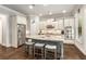 Spacious kitchen with stainless steel appliances, granite countertops, and a large center island with seating at 2750 Vinings Orchard Se Cir, Atlanta, GA 30339