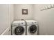 Laundry room features a side-by-side washer and dryer set, ready for efficient laundry at 2750 Vinings Orchard Se Cir, Atlanta, GA 30339