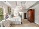 Spacious main bedroom features a tray ceiling, a ceiling fan and carpeted floor at 2750 Vinings Orchard Se Cir, Atlanta, GA 30339