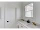 Modern bathroom with dual sinks and a floating vanity with gold fixtures at 961 Nours Cir, Lawrenceville, GA 30045