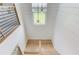 Modern staircase featuring wooden steps, black railings, and abundant natural light at 961 Nours Cir, Lawrenceville, GA 30045