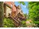 Charming backyard with a wooden deck, lush greenery, and stone pathway, perfect for outdoor relaxation and entertaining at 2314 English Ivy Se Ct, Atlanta, GA 30339