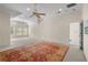 Expansive bonus room with vaulted ceilings, large windows, and a patterned rug, perfect for entertaining guests at 2314 English Ivy Se Ct, Atlanta, GA 30339