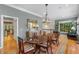 Lovely dining room with decorative lighting, dining table, chairs, and hard wood flooring at 2314 English Ivy Se Ct, Atlanta, GA 30339