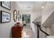 Inviting hallway with elegant decor, stairway, and views into other rooms, creating a warm and welcoming feel at 2314 English Ivy Se Ct, Atlanta, GA 30339