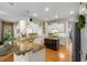 Bright kitchen with white cabinets, hardwood floors, granite countertops, and stainless steel appliances at 2314 English Ivy Se Ct, Atlanta, GA 30339