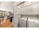 Convenient laundry area with washer, dryer, and ample cabinet storage at 2314 English Ivy Se Ct, Atlanta, GA 30339