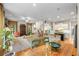 Open-concept living room with dining area, staircase, modern kitchen, and hardwood floors at 2314 English Ivy Se Ct, Atlanta, GA 30339
