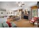 Bright living room with fireplace, large windows, hardwood floors, and stylish furnishings at 2314 English Ivy Se Ct, Atlanta, GA 30339