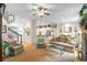 Comfortable living room with neutral tones, a ceiling fan, and easy access to the adjacent kitchen at 2314 English Ivy Se Ct, Atlanta, GA 30339