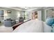 Bright main bedroom with a tray ceiling, accent paint, seating area, and large windows at 2314 English Ivy Se Ct, Atlanta, GA 30339