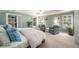 Spacious main bedroom with tray ceiling, ample natural light, and comfortable seating area at 2314 English Ivy Se Ct, Atlanta, GA 30339