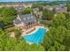 Aerial view of a neighborhood pool, with tanning chairs and landscaping at 2314 English Ivy Se Ct, Atlanta, GA 30339