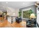Comfortable sitting area with large window, hardwood flooring, and stylish decor at 2314 English Ivy Se Ct, Atlanta, GA 30339