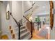 Carpeted staircase with white railings and dark wood accents leading to the upper level at 2314 English Ivy Se Ct, Atlanta, GA 30339