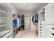 Spacious walk-in closet with custom shelving and ample storage, perfect for organizing clothes and accessories at 2314 English Ivy Se Ct, Atlanta, GA 30339