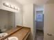 Bathroom featuring a sink, window, and toilet at 70 Wall St, Hampton, GA 30228
