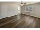 Spacious bedroom with a ceiling fan, large window, and ensuite bathroom at 70 Wall St, Hampton, GA 30228