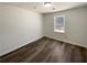 Cozy bedroom with a window for natural light, and modern flooring at 70 Wall St, Hampton, GA 30228