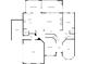 Downstairs floor plan featuring a kitchen, living room, dining area, and garage at 70 Wall St, Hampton, GA 30228