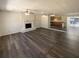 Open concept living area with fireplace and views of kitchen and dining area at 70 Wall St, Hampton, GA 30228