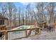 Spacious backyard featuring a pool, gazebo, and a wooden deck with outdoor seating for relaxing at 935 Pine Grove Pointe Dr, Roswell, GA 30075