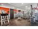 Well-equipped gym with weight machines, a treadmill, and mirrored walls for a complete workout experience at 935 Pine Grove Pointe Dr, Roswell, GA 30075