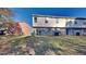 Backyard featuring sliding doors, grass, and building in the background at 955 Magnolia Gardens Walk, Mcdonough, GA 30253