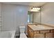 Bright bathroom with a tiled shower-tub, light wood cabinets and an oval sink at 955 Magnolia Gardens Walk, Mcdonough, GA 30253