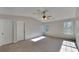 Bright main bedroom featuring carpeted floors, two closets, and two windows at 955 Magnolia Gardens Walk, Mcdonough, GA 30253