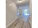 Inviting hallway with gray wood flooring leading to an open living space at 955 Magnolia Gardens Walk, Mcdonough, GA 30253