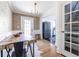 Stylish dining room with patterned wallpaper, modern lighting, and stainless steel refrigerator at 971 Cherokee Se Ave, Atlanta, GA 30315