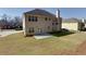 Aerial view of backyard with patio and green lawn at 1368 Fall River Dr, Conyers, GA 30013