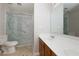 Bathroom with marble shower, tile floors, and modern sink at 1368 Fall River Dr, Conyers, GA 30013